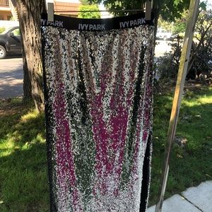 Never worn- silver sequin midi skirt with slit